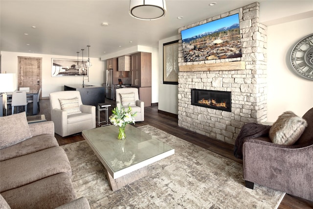 311E Akers Ln Unit E, Whitefish, MT 59937 - living room with wood finished floors, a stone fireplace, and recessed lighting