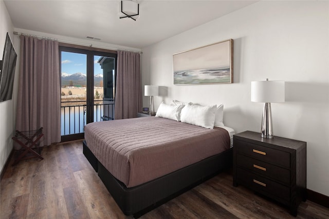 311E Akers Ln Unit E, Whitefish, MT 59937 - bedroom featuring access to outside and dark wood-style floors