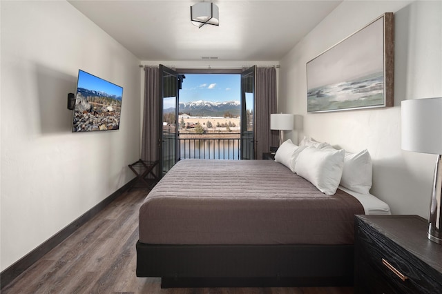 311E Akers Ln Unit E, Whitefish, MT 59937 - bedroom with wood finished floors and access to exterior