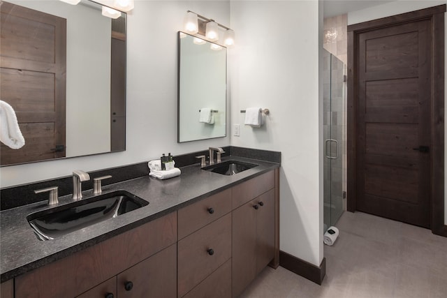 311E Akers Ln Unit E, Whitefish, MT 59937 - full bathroom featuring double vanity, a stall shower, and tile patterned floors