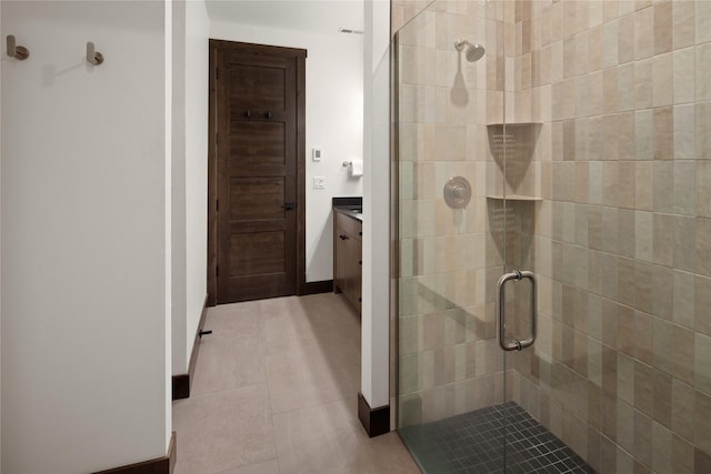 311E Akers Ln Unit E, Whitefish, MT 59937 - full bathroom with a stall shower, vanity, and tile patterned flooring