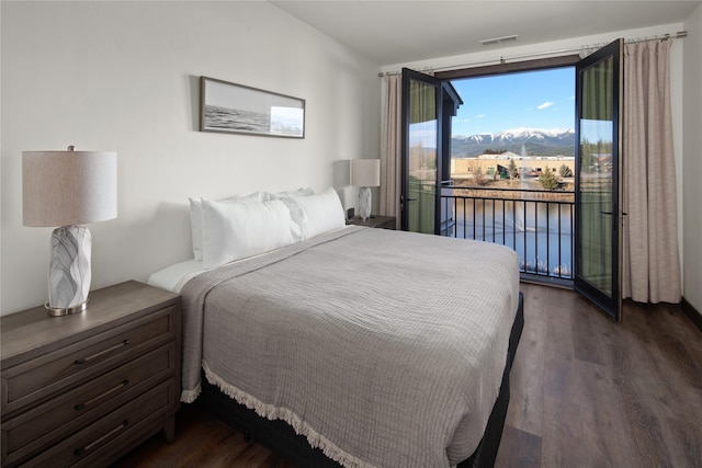 311E Akers Ln Unit E, Whitefish, MT 59937 - bedroom featuring access to outside, dark wood-style floors, and a water view