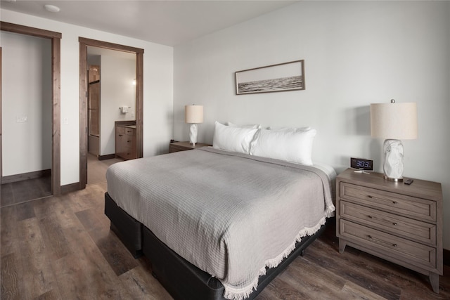 311E Akers Ln Unit E, Whitefish, MT 59937 - bedroom with wood finished floors and connected bathroom