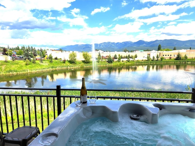 311E Akers Ln Unit E, Whitefish, MT 59937 - water view featuring a mountain backdrop
