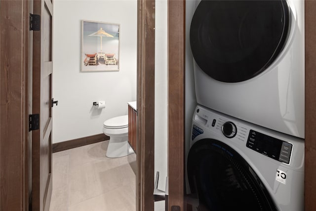 311E Akers Ln Unit E, Whitefish, MT 59937 - laundry room featuring stacked washer / dryer and tile patterned floors
