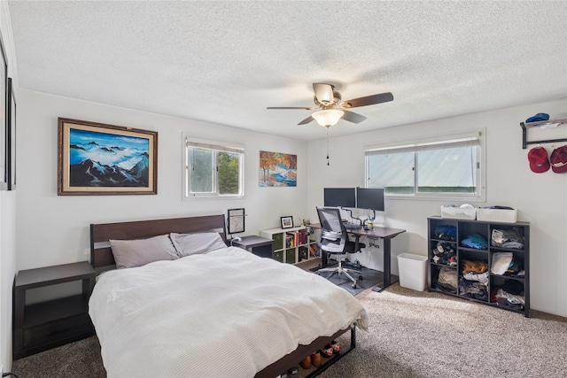 1970 Benchmark Ln, Whitefish, MT 59937 - carpeted bedroom with a textured ceiling, a ceiling fan, and an office area