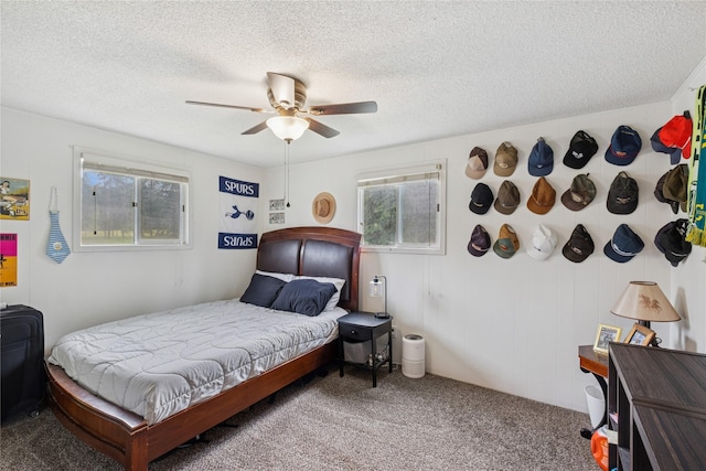 1970 Benchmark Ln, Whitefish, MT 59937 - bedroom featuring carpet flooring, a textured ceiling, and ceiling fan