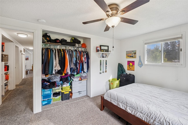 1970 Benchmark Ln, Whitefish, MT 59937 - bedroom featuring carpet flooring, a closet, a textured ceiling, and ceiling fan