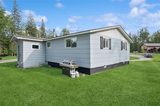 1970 Benchmark Ln, Whitefish, MT 59937 - back of property featuring a yard, board and batten siding, and crawl space