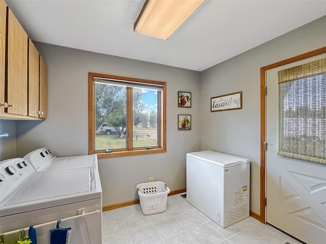 2 Hardy Cir, Ennis, MT 59729 - laundry room with cabinet space, washing machine and dryer, and light tile patterned floors