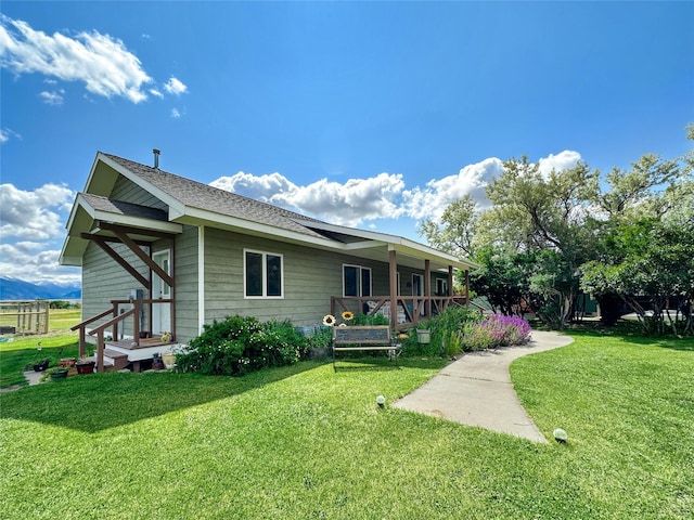 2 Hardy Cir, Ennis, MT 59729 - rear view of house featuring a yard and a shingled roof