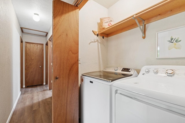 257 Fawn Trl, Whitefish, MT 59937 - laundry area with washing machine and dryer and wood finished floors