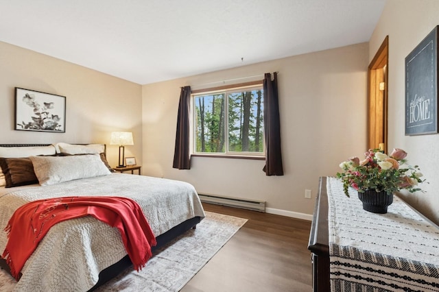 257 Fawn Trl, Whitefish, MT 59937 - bedroom with a baseboard radiator and wood finished floors