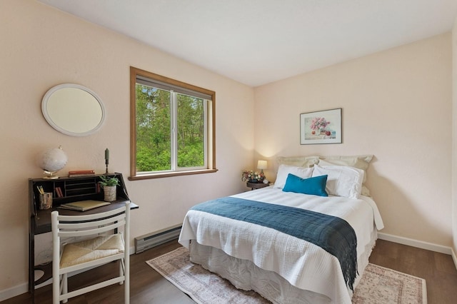 257 Fawn Trl, Whitefish, MT 59937 - bedroom with a baseboard heating unit and wood finished floors