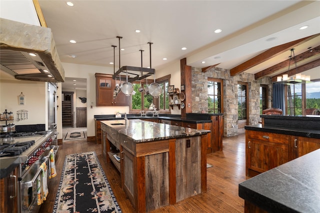 1263 Spencer Ridge Rd, Whitefish, MT 59937 - kitchen featuring a large island, extractor fan, recessed lighting, dark wood-style flooring, and double oven range