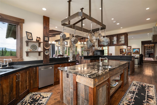 1263 Spencer Ridge Rd, Whitefish, MT 59937 - kitchen featuring dishwasher, a large island with sink, recessed lighting, dark wood-type flooring, and open shelves