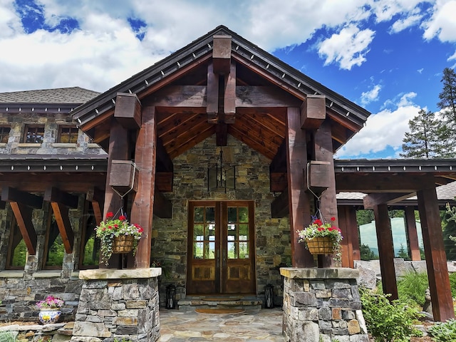 1263 Spencer Ridge Rd, Whitefish, MT 59937 - property entrance with stone siding and french doors