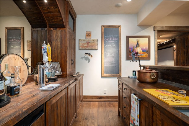 1263 Spencer Ridge Rd, Whitefish, MT 59937 - bar area featuring dark wood-style flooring and baseboards