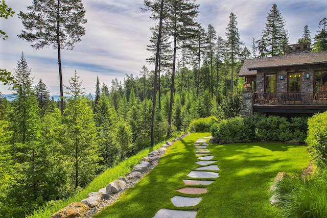 1263 Spencer Ridge Rd, Whitefish, MT 59937 - view of green lawn with a deck
