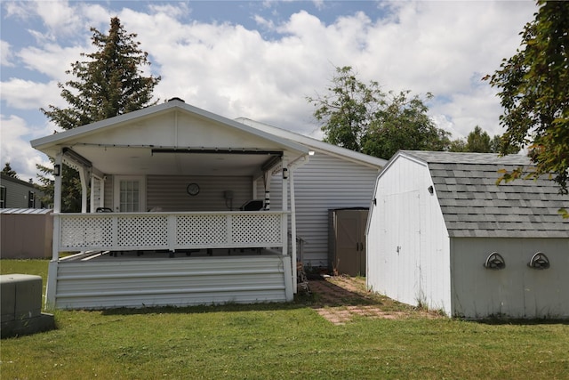 3000 Villard Ave Unit 149, Helena, MT 59601 - back of property with a shed, a yard, and roof with shingles