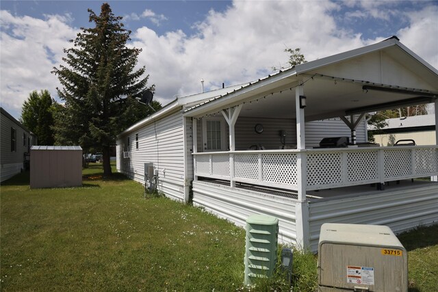 3000 Villard Ave Unit 149, Helena, MT 59601 - view of side of home featuring a yard and a shed