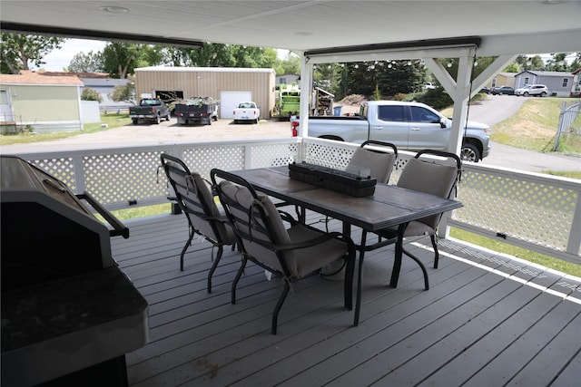 3000 Villard Ave Unit 149, Helena, MT 59601 - wooden deck featuring outdoor dining area