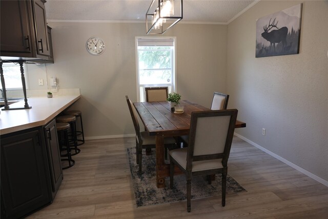 3000 Villard Ave Unit 149, Helena, MT 59601 - dining room featuring crown molding and light wood-style floors