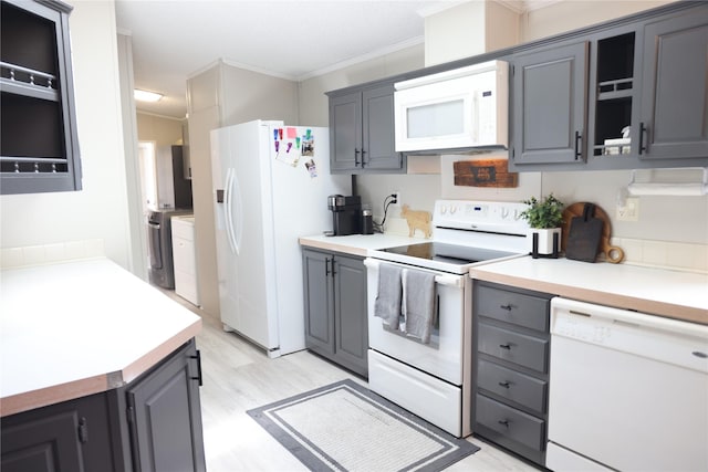 3000 Villard Ave Unit 149, Helena, MT 59601 - kitchen with white appliances, gray cabinets, ornamental molding, light wood-style flooring, and light countertops