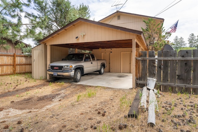 105 S Clifton St, Darby, MT 59829 - garage with dirt driveway and a carport