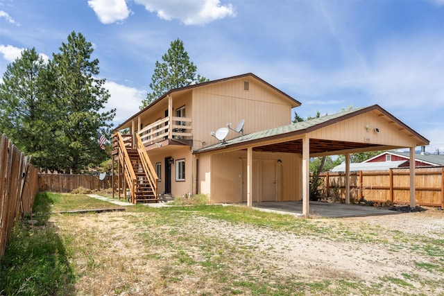 105 S Clifton St, Darby, MT 59829 - rear view of property featuring a fenced backyard, stairs, and a wooden deck