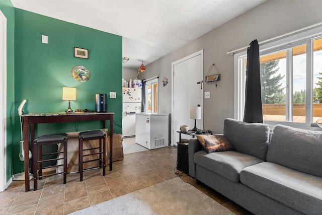 105 S Clifton St, Darby, MT 59829 - living room featuring healthy amount of natural light and stone finish flooring