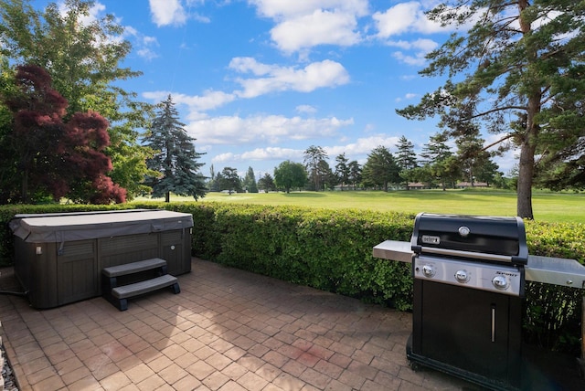 18 Buffalo Hill Cir, Kalispell, MT 59901 - view of patio with area for grilling and a hot tub