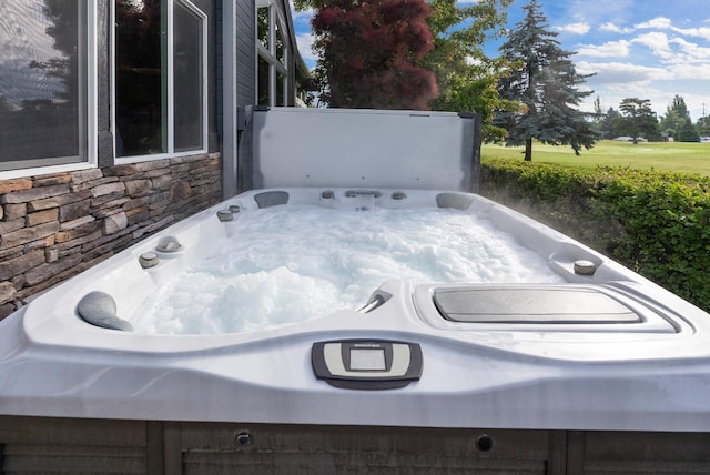 18 Buffalo Hill Cir, Kalispell, MT 59901 - exterior view of a jacuzzi and stone siding