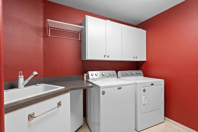 18 Buffalo Hill Cir, Kalispell, MT 59901 - washroom featuring cabinet space, washing machine and dryer, and light tile patterned floors