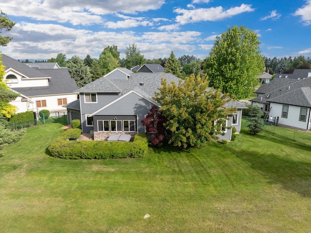 18 Buffalo Hill Cir, Kalispell, MT 59901 - back of house featuring a fenced backyard, a patio, a residential view, and roof with shingles