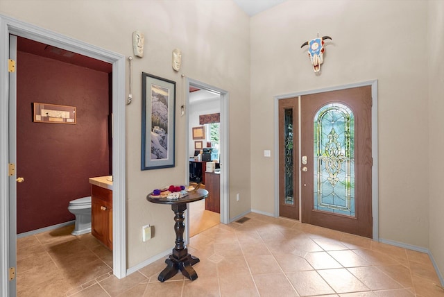 18 Buffalo Hill Cir, Kalispell, MT 59901 - entrance foyer with healthy amount of natural light, light tile patterned floors, and a towering ceiling