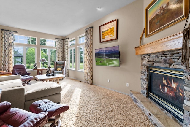 18 Buffalo Hill Cir, Kalispell, MT 59901 - carpeted living room featuring a stone fireplace and baseboards