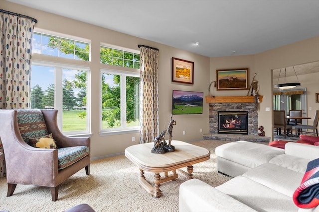 18 Buffalo Hill Cir, Kalispell, MT 59901 - carpeted living area featuring healthy amount of natural light and a stone fireplace