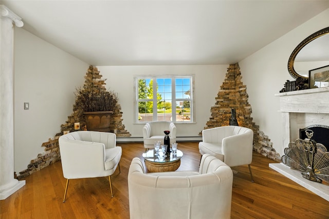 12 Pathfinder Trl, Bozeman, MT 59718 - living room featuring a fireplace with raised hearth and wood finished floors