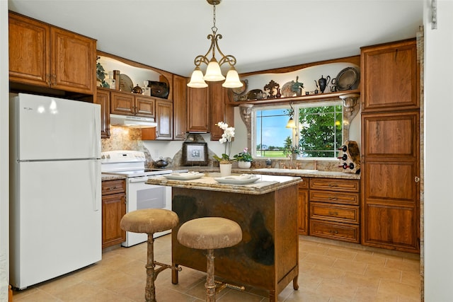 12 Pathfinder Trl, Bozeman, MT 59718 - kitchen featuring white appliances, under cabinet range hood, open shelves, and brown cabinets