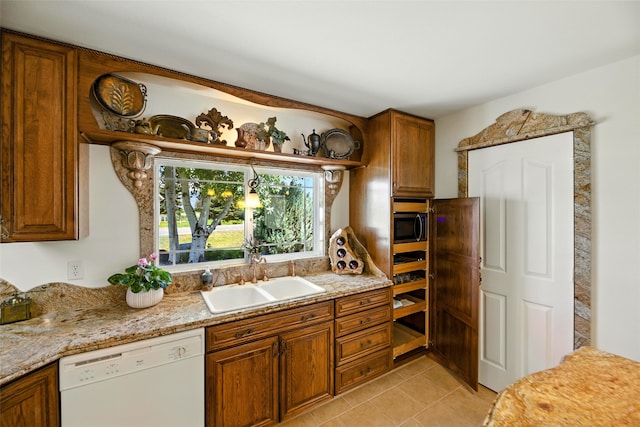 12 Pathfinder Trl, Bozeman, MT 59718 - kitchen with white dishwasher, brown cabinets, light tile patterned flooring, and stainless steel microwave