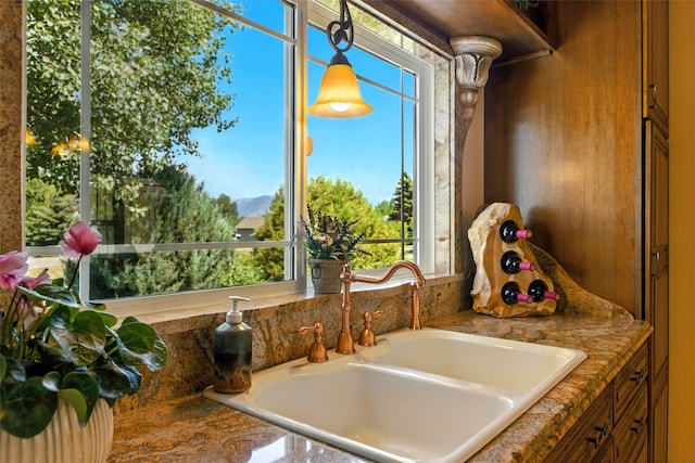 12 Pathfinder Trl, Bozeman, MT 59718 - kitchen view of a sink and brown cabinetry