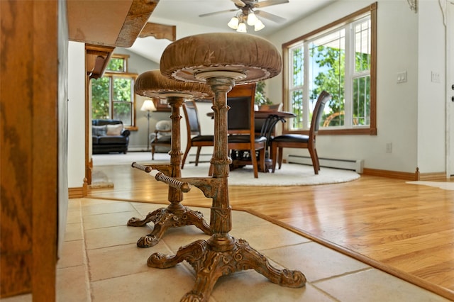 12 Pathfinder Trl, Bozeman, MT 59718 - dining room with ceiling fan, wood finished floors, and a baseboard radiator