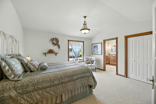 12 Pathfinder Trl, Bozeman, MT 59718 - carpeted bedroom with vaulted ceiling, connected bathroom, and a closet