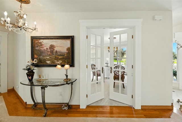12 Pathfinder Trl, Bozeman, MT 59718 - entrance foyer with a chandelier, french doors, and wood finished floors