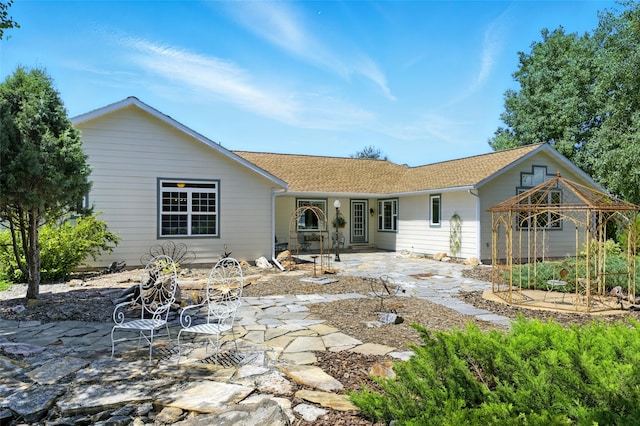 12 Pathfinder Trl, Bozeman, MT 59718 - rear view of house with a patio and a shingled roof
