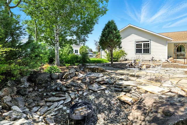 12 Pathfinder Trl, Bozeman, MT 59718 - view of yard with a patio area and a fire pit
