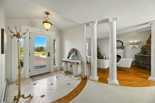 12 Pathfinder Trl, Bozeman, MT 59718 - tiled foyer entrance featuring baseboard heating, decorative columns, and vaulted ceiling