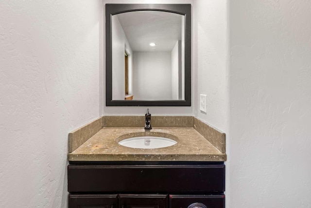 32785 Linden Ln, Bigfork, MT 59911 - bathroom featuring vanity and a textured wall