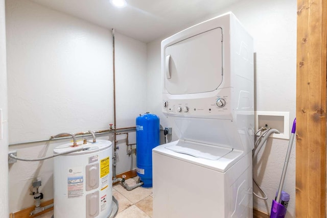 32785 Linden Ln, Bigfork, MT 59911 - laundry area featuring electric water heater and stacked washer / drying machine